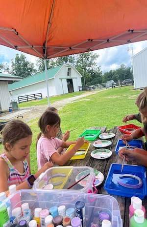 Kids doing crafts at Redbird Equestrian