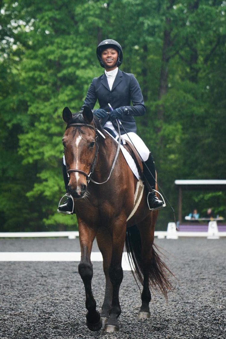 teen rider on horseback in an eventing show by redbird equestrian